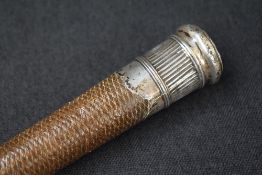A white metal mounted riding crop, the woven body with a rounded top, engraved 'Tho Hodgson 1771