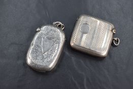 An Edwardian silver vesta case, having floral engraving and shield cartouche engraved 'WRE', along