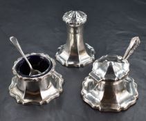 An early 20th century silver three-piece condiment set, of spreading stylised petal design with