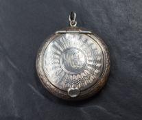 A George VI silver powder compact, of circular form having engine turned decoration with central