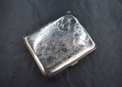 A George V silver cigarette case of hinged rectangular form, having engraved decorative bow and