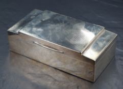 A George V silver cigarette box, of hinged rectangular form with engine turned decoration to lid,