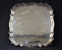 An Elizabeth II silver presentation salver, having Chippendale inspired rim with engraving '