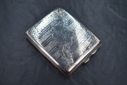 A late Edwardian silver cigarette case of hinged rectangular form, having engine turned decoration