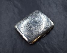 A George V silver cigarette case of hinged square form curved for the gentleman's pocket, having
