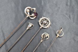 A group of five Charles Horner silver hat pins of various design, sold along with the base of a