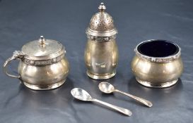 A cased set of Elizabeth II silver condiment set, comprising salt, mustard and pepperette, of