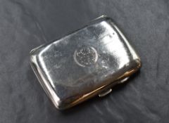 An early George V silver cigarette case of hinged rectangular form, having engine turned