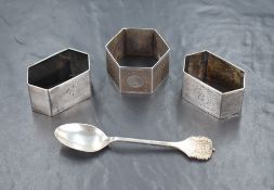 Three early 20th century silver napkin rings, all of hexagonal form having engine turned