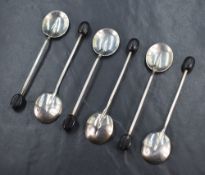 A cased set of George V silver coffee bean spoons, having a rat tail style design, marks for
