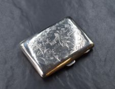 A George V silver cigarette case of hinged rectangular form, having engraved floral garlands,