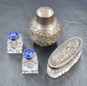 A pair of Norwegian silver mounted cut glass scent bottles, the silver tops having blue guilloche