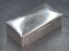 A George V silver cigarette box, of hinged rectangular form with engraved lid 'Captain E.N.G. Earle,