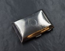 A George V silver cigarette case of hinged rectangular form slightly curved for the gentleman's
