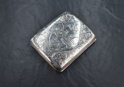 An early George V silver cigarette case of hinged rectangular form curved for the gentleman's