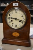 An Edwardian mahogany lancet top mantel clock, having pendulum.
