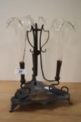 An Art Nouveau silver plate and clear glass three trumpet epergne, the three quatrefoil clear