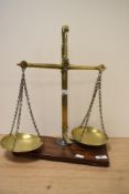 A set of Victorian brass class B beam scales, of traditional arrangement with oblong mahogany