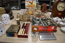 An assortment of plated ware comprising serving tray, cigarette case, thimbles and milk jug etc.