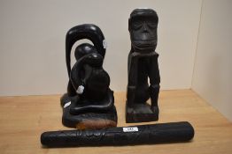 Two carved African blackwood figures sold along with a blackwood truncheon having shamrock design.