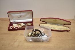 An assortment of wristwatches and pocket watches, including a gold plated Roamer watch face, and a