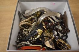 A large collection of costume jewellery, including statement necklaces, belt buckles, imitation
