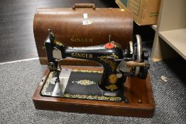 A vintage Singer sewing machine Y745239, completed in hard case with key.