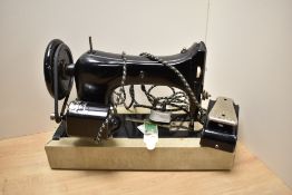 A Taylor Bird sewing machine with Carter electric motor, cased with foot pedal