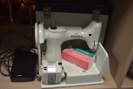 A vintage Singer lightweight 221k sewing machine, sold with hard case and sewing machine