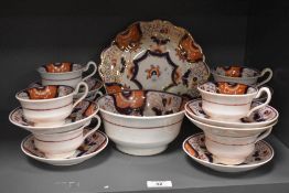 A selection of decorative 'Gaudy Welsh' teawares, each decorated with puce lustre enriched Imari