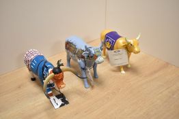 A group of three decorative 'Cow Parade' studies, comprising Lowry Cow, Highland Cow (resin) and