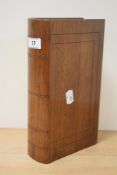 An interesting mahogany book-form secret box, with push and sliding sections revealing a baize lined