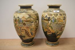 A pair of 20th century Japanese Satsuma pottery vases, of ovoid form and decorated with figures