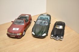 Two Maisto model cars, Jaguar XK8 and Mercedes-Benz 500 SL, together with a Burago Mercedes Benz 300