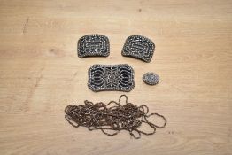A small selection of cut steel including belt buckle, shoe buckles, button and chain