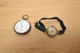 A silver open face pocket watch, the white dial with Roman numerals and subsidiary dial at 6, the