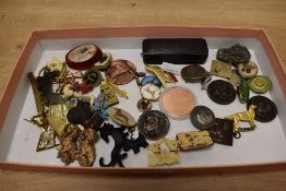 An assortment of dog related brooches and badges, including a broken carved opal stick pin, Crufts