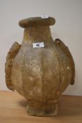 A large rudimentary vessel formed from a camels bladder, with two simple feet and applied