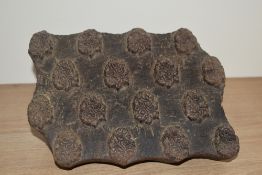 A carved wooden textile printing block, with repeating Paisley/Boteh design 19cm