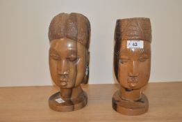 Two 20th Century African carved hardwood busts, each measuring 20cm high