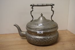 A Turkish embossed white metal flat-bottomed kettle, of traditional design with bands of embossed
