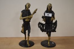 A pair of 20th century African (most likely Bennin) bronze musician figures with patinated