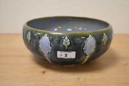 A late 19th Century Royal Doulton fruit bowl, decorated with applied Art Nouveau motifs and designed