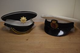 A Merchant Navy officers peaked cap with embroidered bullion and cast metal badge, sold along with a