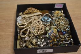 A collection of costume jewellery, including imitation pearls, brooches, statement pieces and beaded
