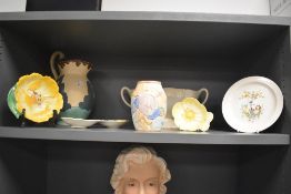 An Art Deco Beswick Ware jug, hand decorated in a Clarice Cliff style pattern and measuring 28cm