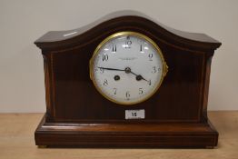 A good quality Edwardian inlaid-mahogany arched top mantel clock, retailed by Hamilton & Inches,