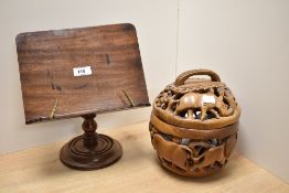 An interesting African carved and pierced wood 'basket' of globular form with lift-off cover,