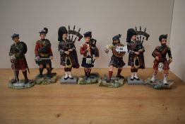 A group of seven 'Sculptures UK Scotish Higlander military figues, including three pipers 17cm