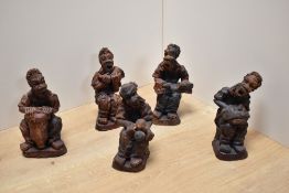 An interesting group of five African terracotta musician figures, each modelled seated hoding
